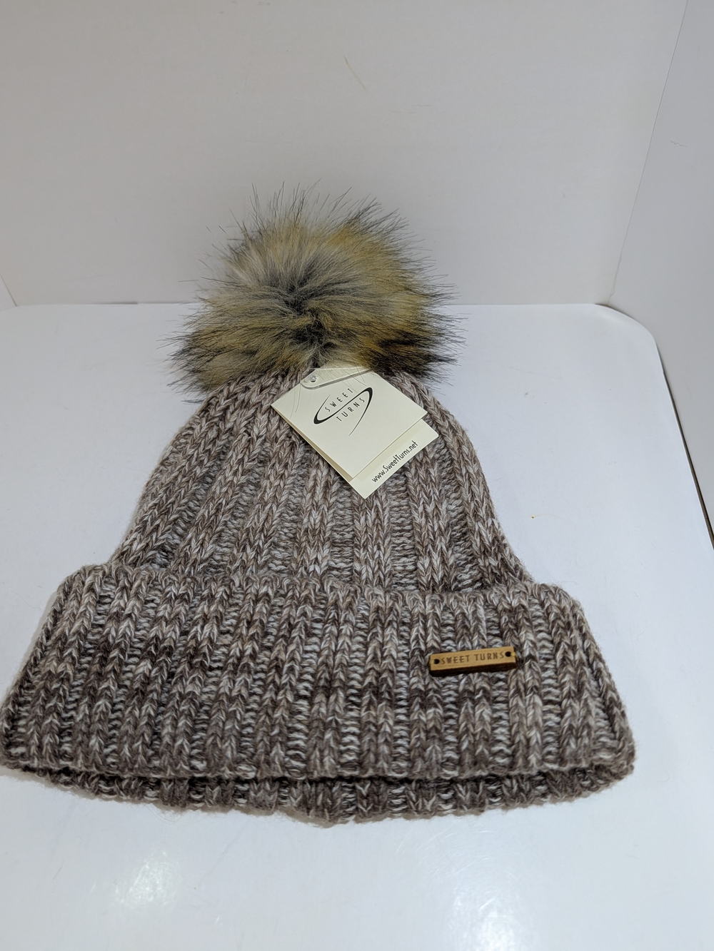 Sweet Turns knit pompom fleece lined beanie hat